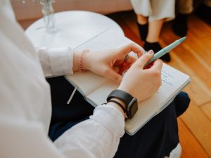 Therapist using journaling strategies for independent living with a client.