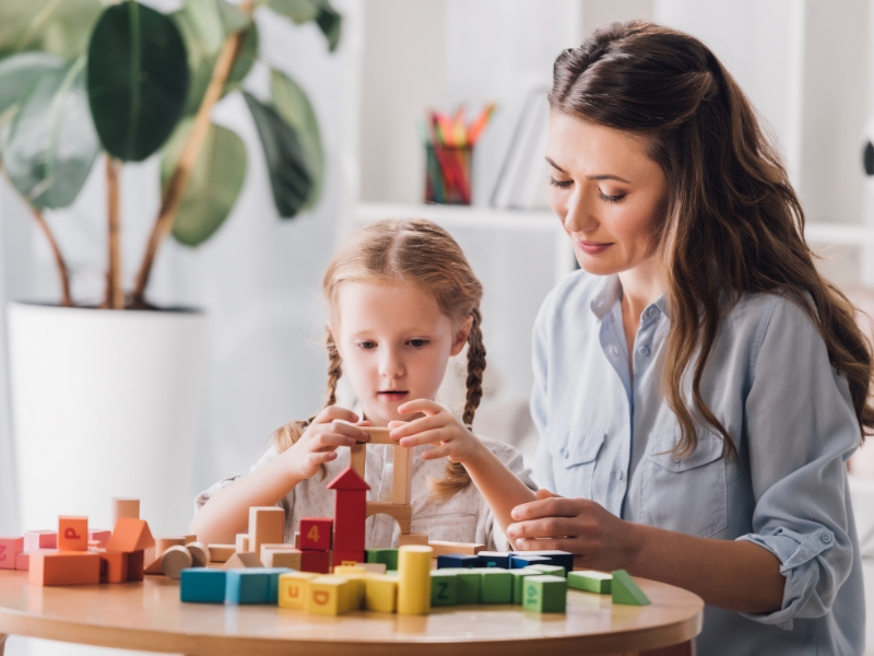 NDIS Support for Autism focusing on speech therapy with alphabet puzzle